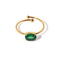 Emerald Spark Ring — emerald-green zircon adjustable ring in 18k gold-plated stainless steel, front view
