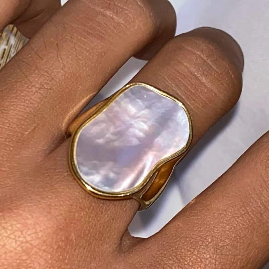 White Stone Ring — zircon solitaire ring worn on the finger