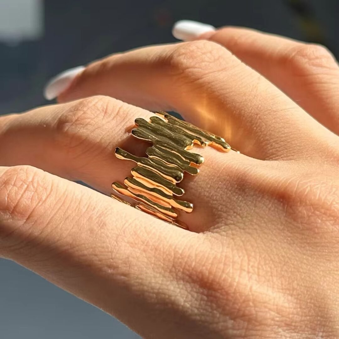 Cove Ring — curved gold band worn on the finger