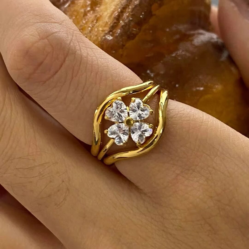 Mystic Flower Set of 3 — three matched stacking rings with zircon flower in 18k gold plating, front view