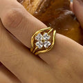 Mystic Flower Set of 3 — three matched stacking rings with zircon flower in 18k gold plating, front view