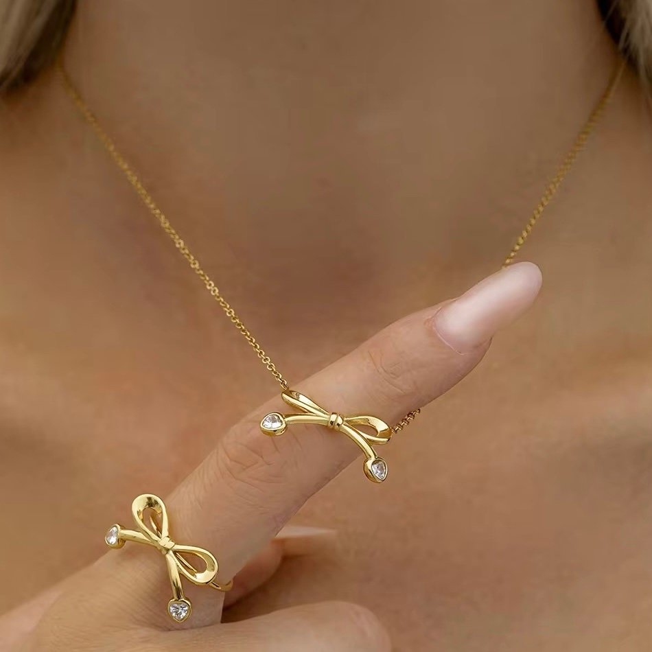 Bow Necklace — zircon bow necklace worn at the collarbone