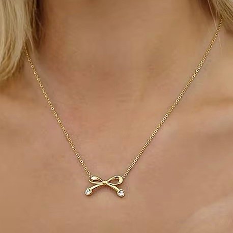 Bow Necklace — close-up of zircon along the bow loops
