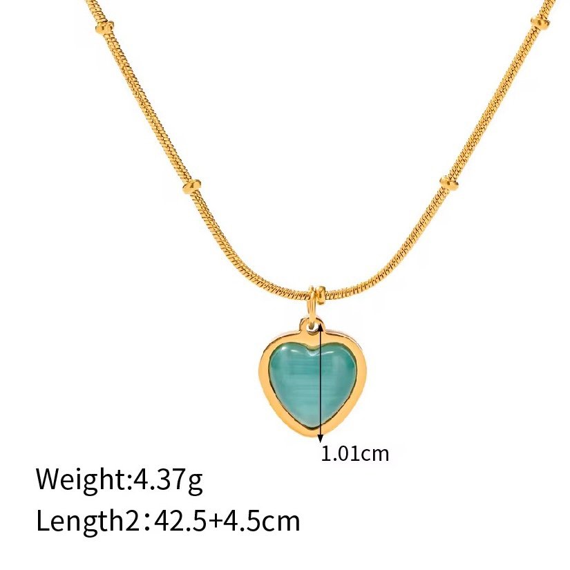 Aqua Heart — blue heart pendant on fine gold chain, close-up