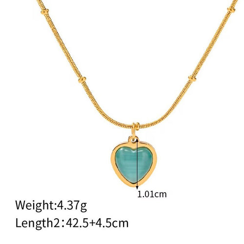 Aqua Heart — blue heart pendant on fine gold chain, close-up