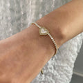 Adore You Bracelet — zircon-set gold bracelet in 18k gold-plated stainless steel, front view