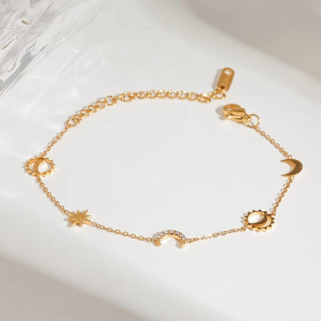 Cosmic Charm Bracelet — star and moon charms on gold-plated chain