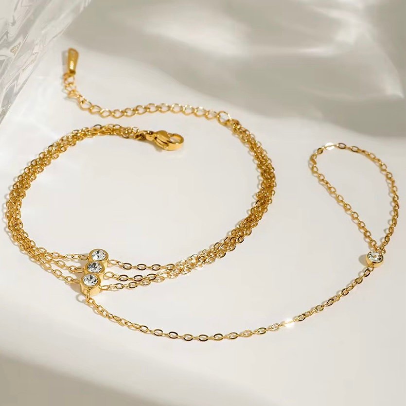 Bond Hand Chain — zircon hand chain joining bracelet and ring, front view
