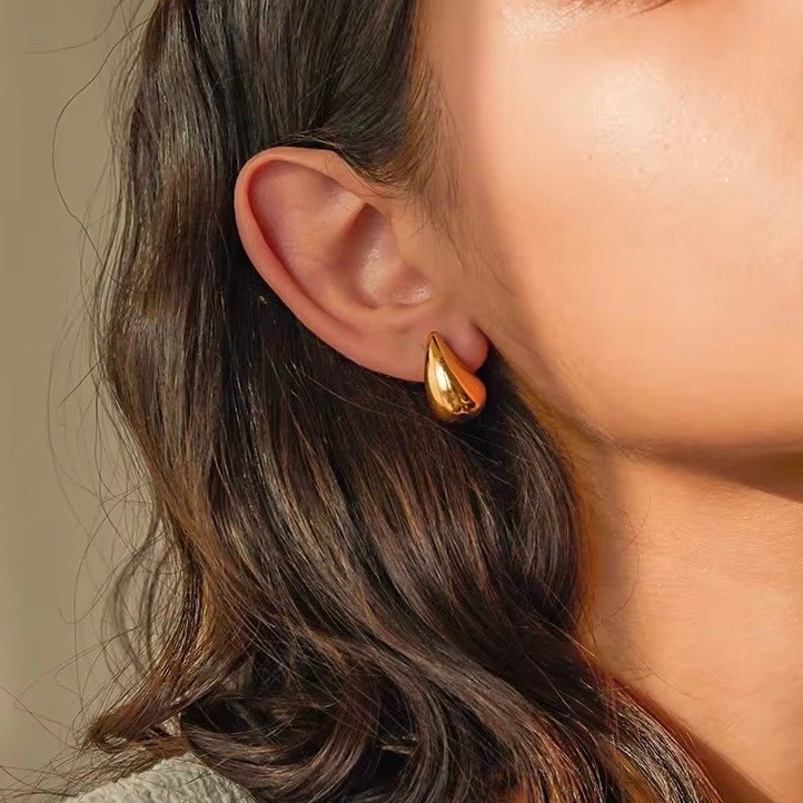 Mini Bodega Earrings — close-up of gold plating