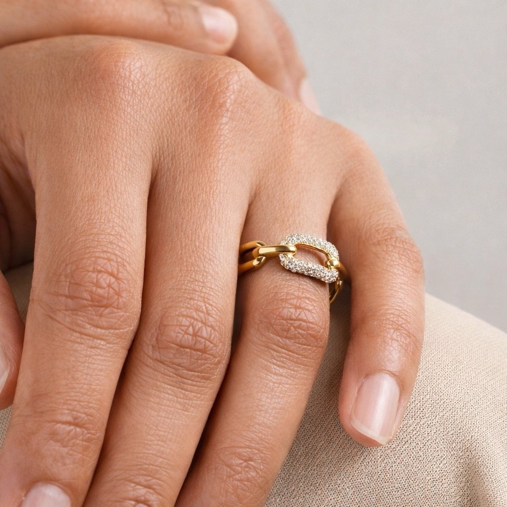 Connect — linked gold ring worn on the finger
