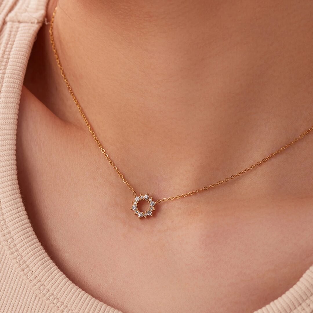 Halo — zircon halo necklace styled flat lay
