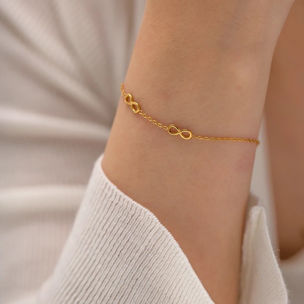 Infinity Bracelet — gold-plated infinity bracelet worn on the wrist