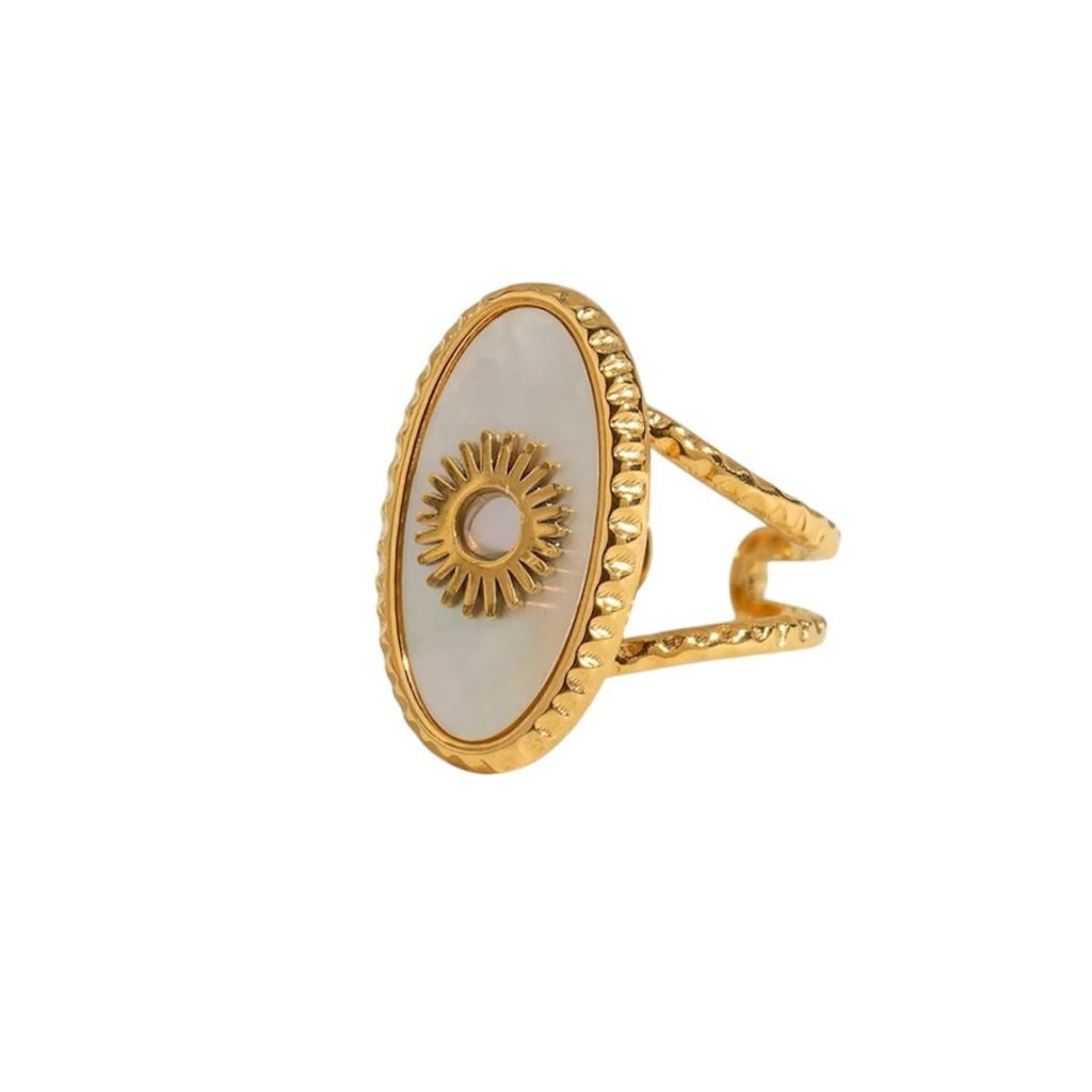 Ivory Sun Ring — sunburst ring on a plain background
