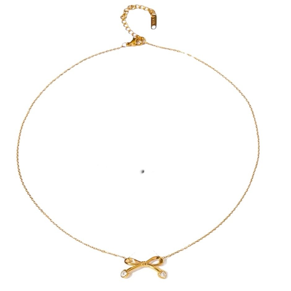 Bow Necklace — gold-plated bow pendant, detail