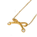 Bow Necklace — zircon bow pendant in 18k gold-plated stainless steel, front view